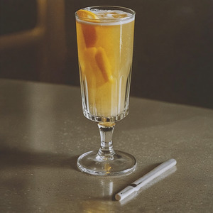 An image of the Well Baked Tart cocktail submitted by n0tquitethere that contains Cherry Brandy, Amaretto and Champagne