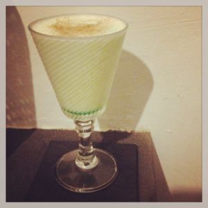 An image of the Absinthe Suissesse cocktail submitted by n0tquitethere that contains Egg, Simple Syrup, Absinthe, Cream, Crème de Menthe and Nutmeg
