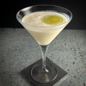 An image of the Coconut Colada cocktail submitted by n0tquitethere that contains White Rum, Pineapple Juice, Lime, Coconut Sorbet and Lime