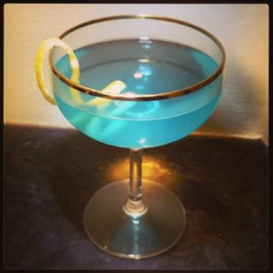 An image of the Dogfight cocktail submitted by Toby that contains Bourbon, Amaro Nonino, Aperol, Orange Bitters and Lemon