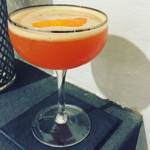 An image of the Fancy Nancy cocktail submitted by n0tquitethere that contains Lemon Vodka, Sweet Vermouth, Curaçao Triple Sec, Turin Bitters, Orange and Orange