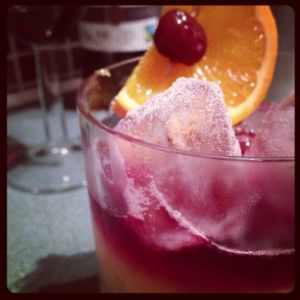 An image of the New York Sour cocktail submitted by n0tquitethere that contains Rye Whiskey, Lemon, Simple Syrup, Dry Red Wine, Orange and Cocktail Cherry