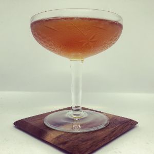 An image of the Newton's Special cocktail submitted by n0tquitethere that contains Brandy, Curaçao Triple Sec and Angostura Bitters
