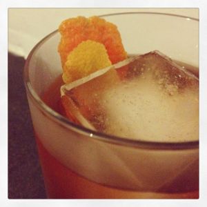 An image of the Nth Degree cocktail submitted by n0tquitethere that contains Agricole Rhum, Apple Brandy, Green Chartreuse, Demerara Sugar, Whiskey Barrel Aged Bitters, Orange and Lemon