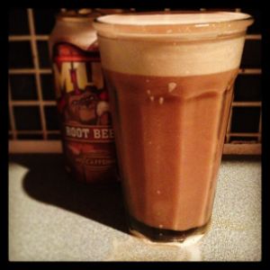 An image of the Suhm Heering Float cocktail submitted by n0tquitethere that contains Cherry Brandy, Gold Rum, Xocolatl Mole Bitters, Egg and Root Beer