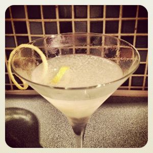 An image of the Sunflower Cocktail cocktail submitted by n0tquitethere that contains London Dry Gin, St Germain, Curaçao Triple Sec, Lemon, Lemon and Absinthe