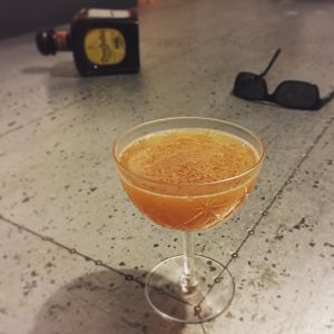 An image of the Under the Volcano cocktail submitted by n0tquitethere that contains Anejo Tequila, Lime, Yellow Chartreuse, Cynar and Agave Nectar