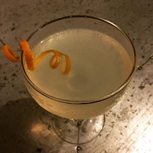 An image of the West Indian Summer cocktail submitted by n0tquitethere that contains Kümmel, London Dry Gin, Lemon, Maraschino Liqueur, Simple Syrup, Orange Bitters and Orange