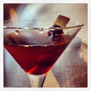 An image of the Whitfield Takes Manhatten cocktail submitted by n0tquitethere that contains Bourbon, Sweet Vermouth, Cherry Brandy, The Bitter Truth Jerry Thomas' Own Decanter Bitter and Cocktail Cherry