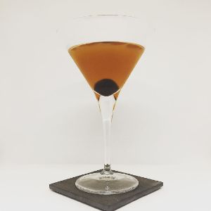 An image of the The Widow's Kiss cocktail submitted by n0tquitethere that contains Apple Brandy, Green Chartreuse, Benedictine DOM, Angostura Bitters and Cocktail Cherry